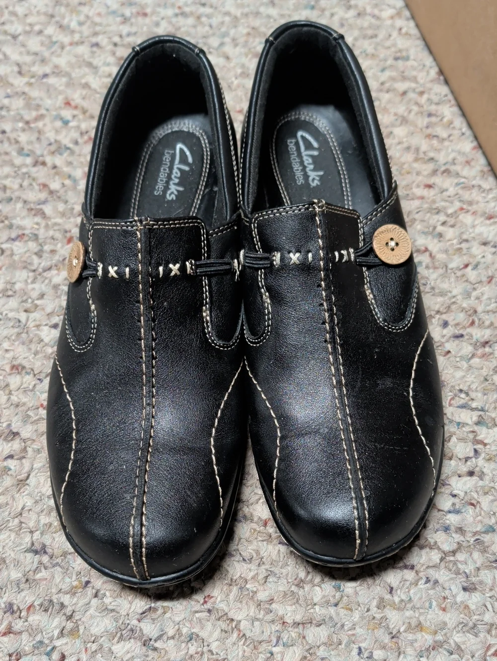 Clarks Black Leather Slip-On Loafers with Contrast Stitching and Button Accent